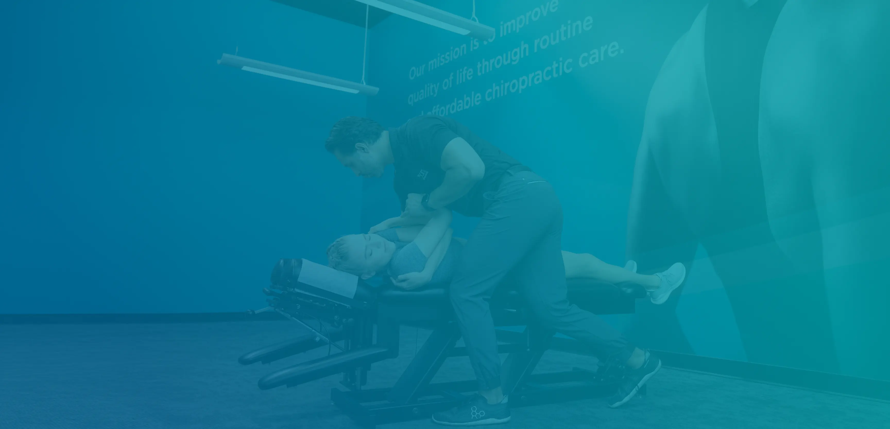 Chiropractic adjustment shown in The Joint’s official brand photography